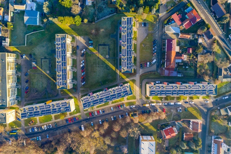 a bird's eye view of a parking lot, by Jakob Gauermann, shutterstock, ruined subdivision houses, solar, in australia, swedish urban landscape