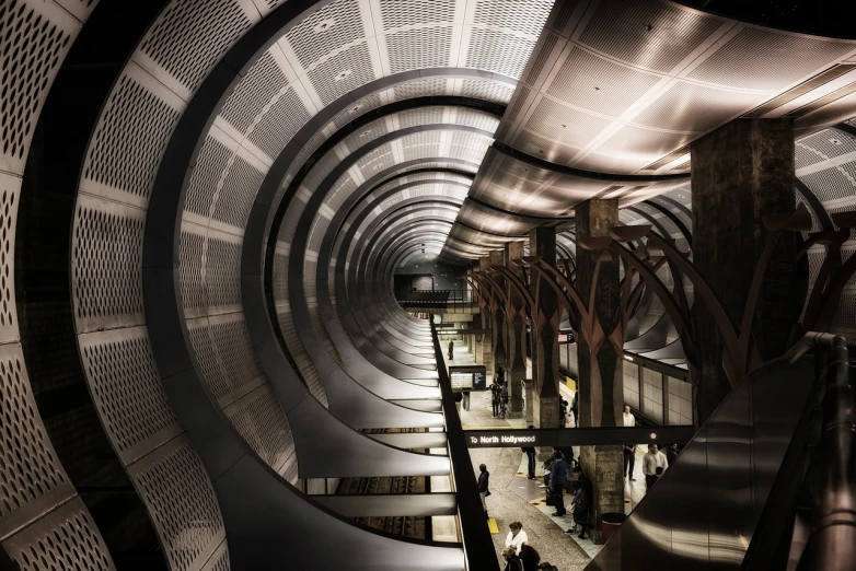 a group of people walking down an escalator, a digital rendering, by Zha Shibiao, dark train tunnel entrance, manhattan, dieselpunk railway station, awarded winning photo