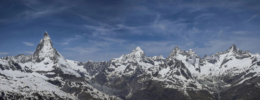 a group of people riding skis on top of a snow covered mountain, by Werner Andermatt, pixabay, plein air, panorama distant view, glacier photography, - - ar 9 : 1 6, alpine scenery