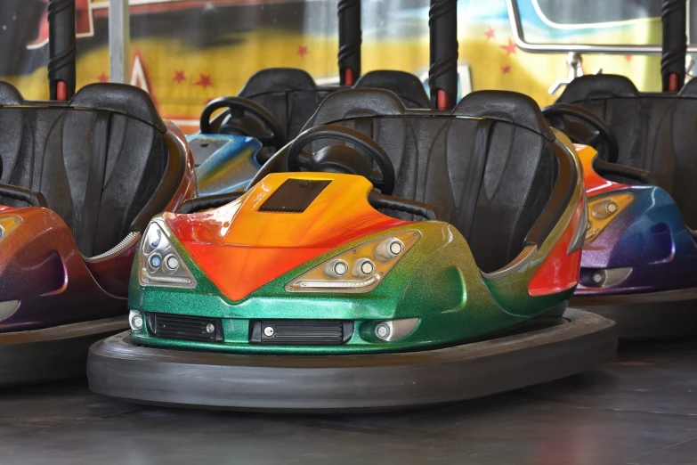 a row of bumper cars sitting next to each other, flying saucer, vehicle, horns with indicator lights, 120mm