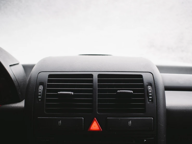 a close up of the dashboard of a car, a stock photo, by Matthias Weischer, postminimalism, air conditioner, plain background, mercedes and volkswagen, dangerous depressing atmosphere