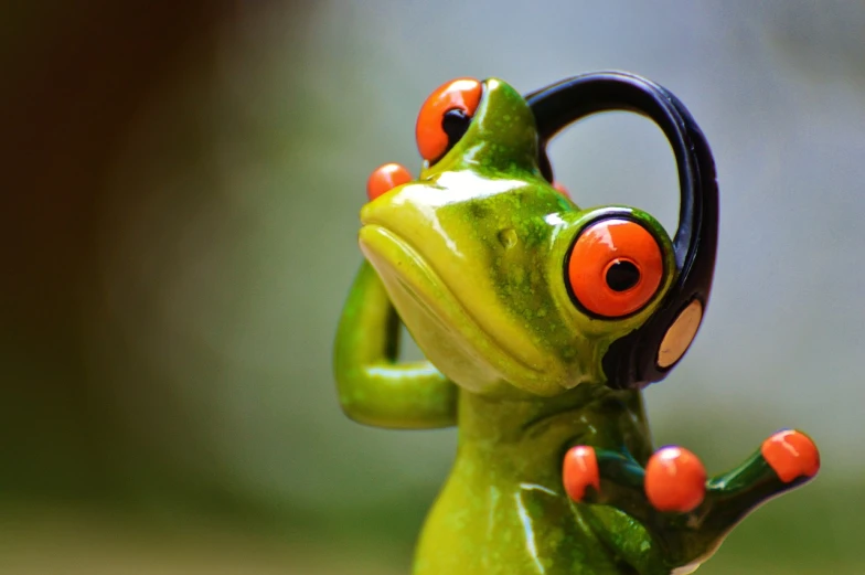 a figurine of a frog with headphones on, a picture, by Edward Corbett, pexels, figuration libre, aaaaaaaaaaaaaaaaaaaaaa, reggae, biological, huge success