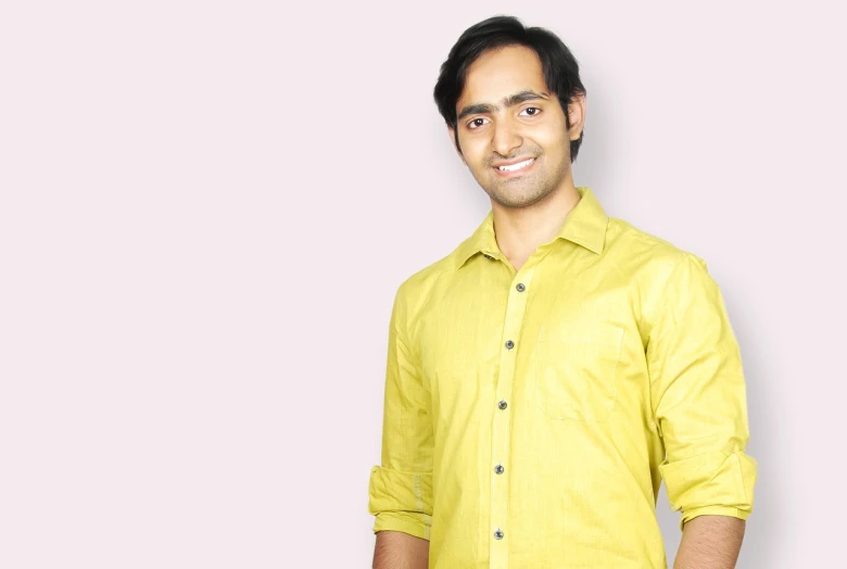 a man in a yellow shirt posing for a picture, inspired by Jitish Kallat, clean background, avatar for website, around 1 9 years old, high-resolution photo