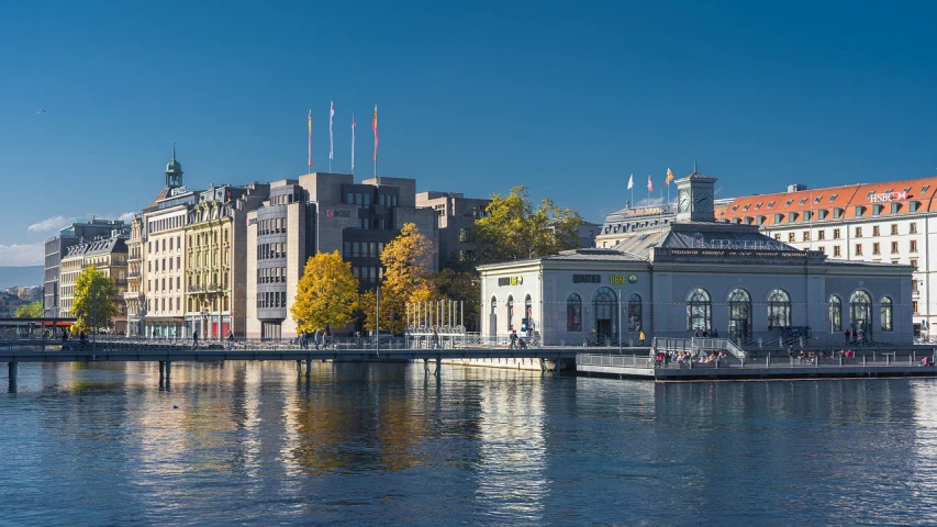 a body of water with buildings in the background, a photo, by Jens Søndergaard, mcgill, autum, terminal, on a great neoclassical square