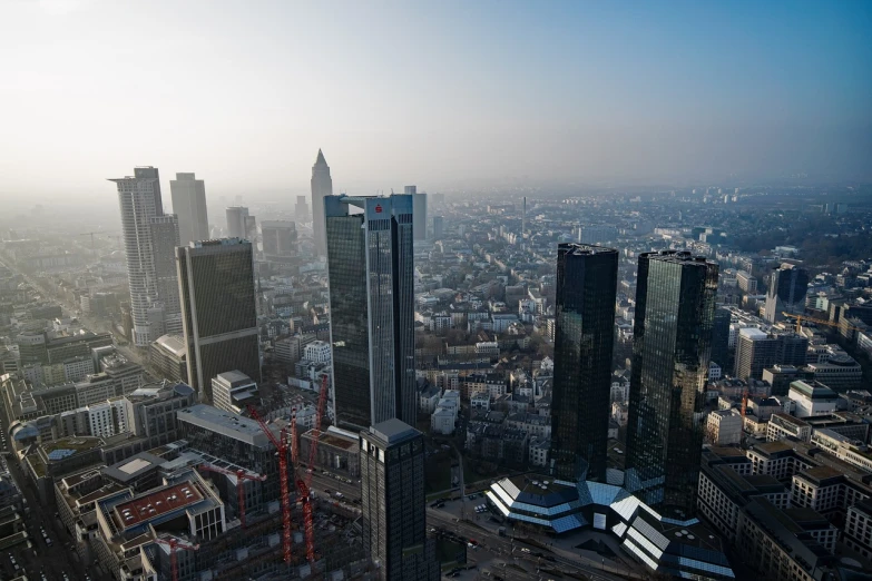 a view of a city from the top of a building, by Sebastian Spreng, germany. wide shot, morning haze, benjamin vnuk, towers