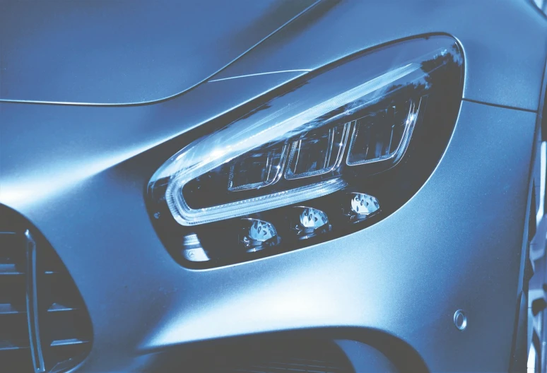 a close up of the headlights of a car, a digital rendering, by Jakob Gauermann, pexels, light blue, mercedes, a super-smart, full view of a sport car