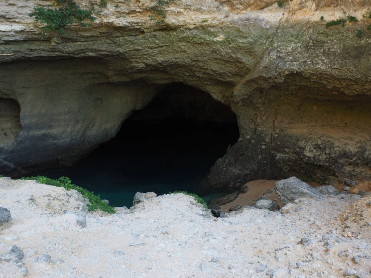 a cave with a hole in the middle of it, les nabis, apulia, tar pit, octa 8k, entrance