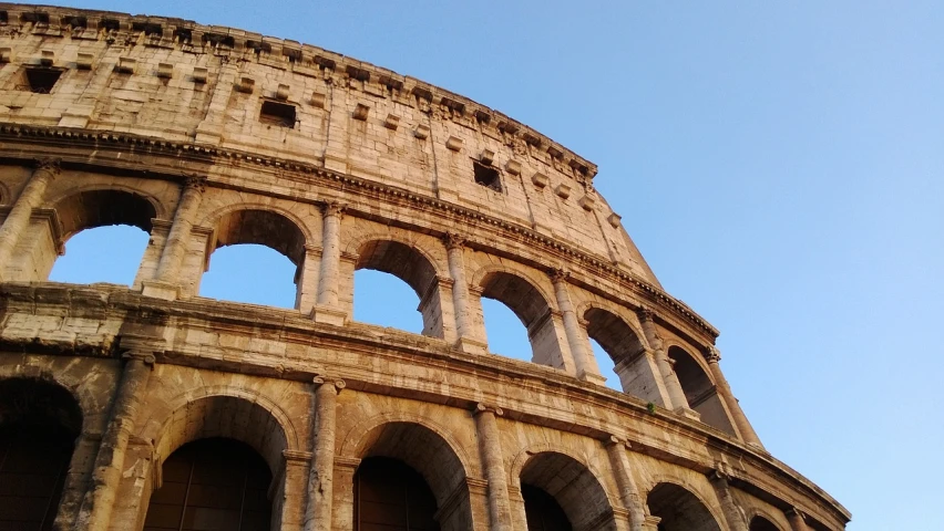 a close up of a building with arches, a picture, by Pogus Caesar, pexels contest winner, roman gladiator, view from the side”, 6 4 0, phone photo