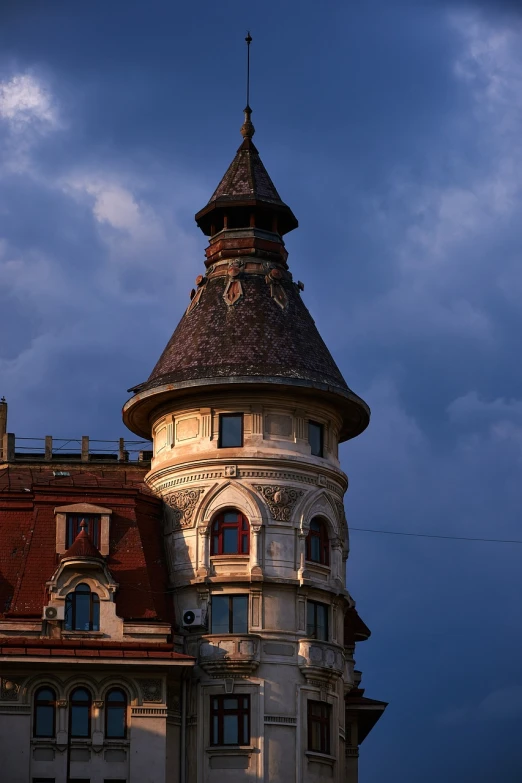 a tall building with a clock on top of it, a picture, by Ihor Podolchak, shutterstock, art nouveau, evening storm, rounded roof, highly detailed photo 4k, located in a castle
