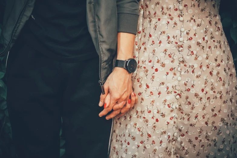 a close up of two people holding hands, a picture, by Romain brook, romanticism, retro vibe, background image, attractive girl, professional detailed photo