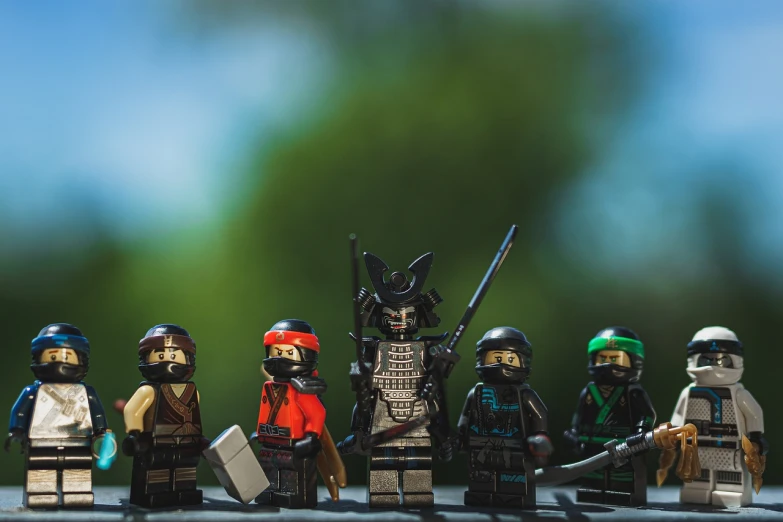 a group of lego figures sitting next to each other, inspired by Kanō Hōgai, figuration libre, high quality fantasy stock photo, special forces, nice afternoon lighting, wide shot photo