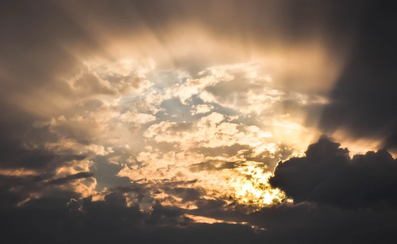 a large jetliner flying through a cloudy sky, a picture, by Niko Henrichon, pexels, romanticism, sunbeams at sunset, golden hour closeup photo, divine ray over her head, miraculous cloudy backdrop