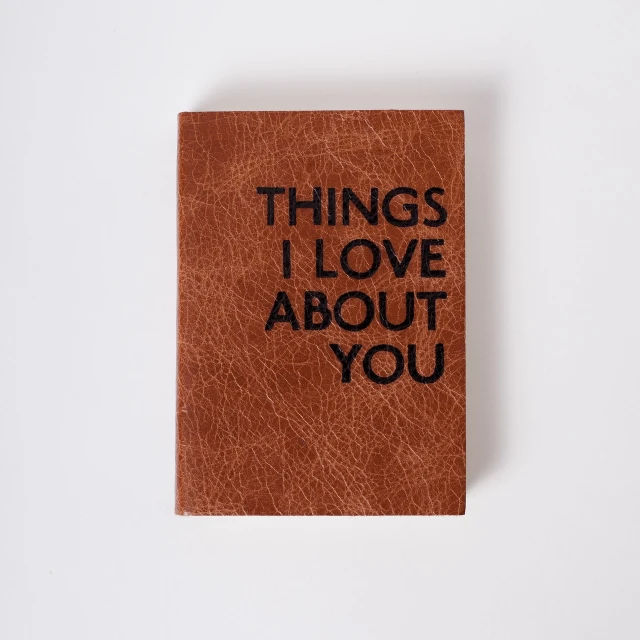 a book with the words things i love about you written on it, a picture, bauhaus, leather, high quality product photo, grain”, detailed product photo
