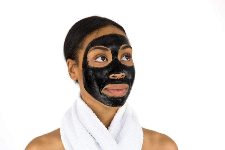 a woman with a black mask on her face, clean clear face, african american, amazonian, coal
