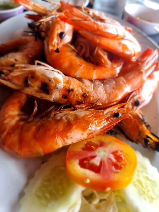 a close up of a plate of food with shrimp, a photo, figuration libre, summer feeling, viewed from below, grill, very realistic looking