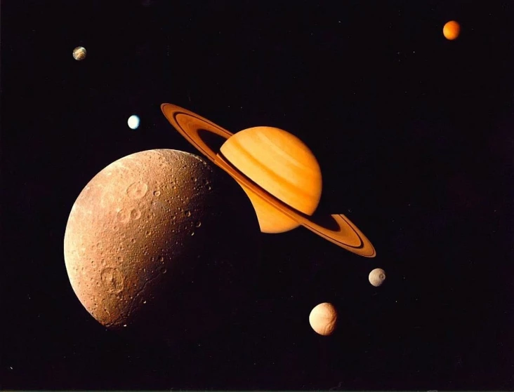 an image of a group of planets in the sky, by Jim Burns, high detailed close up of, 1960s color photograph, photo taken in 1989, saturn