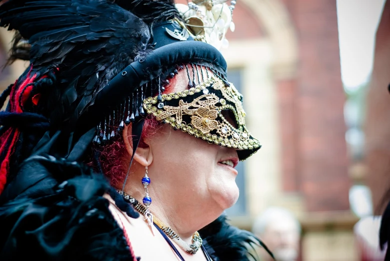 a close up of a person wearing a costume, by Robin Guthrie, shutterstock, renaissance, the empress of licorice, reportage photography, candid shot, middle-aged witch