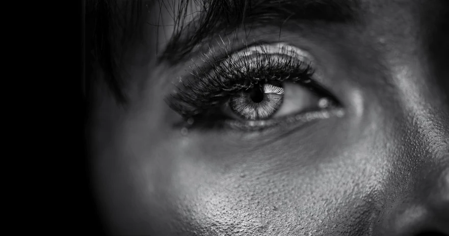 a black and white photo of a woman's eye, by irakli nadar, pexels contest winner, hyperrealism, 8k 50mm iso 10, shot on canon eos r5, realistic face moody lighting, detailed body and eyes