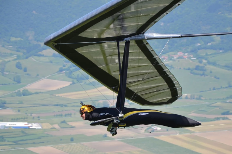 a person that is flying in the air, a picture, by Ludovit Fulla, shutterstock, wearing winged helmet, glass and metal : : peugot onyx, gliding, frank sedlacek