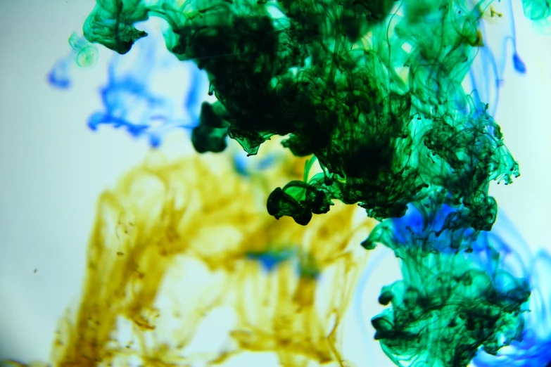 a close up of green and blue ink in water, a microscopic photo, inspired by Kim Keever, flickr, yellow navy teal black and gold, (high contrast), view from below, marble!! (eos 5ds r