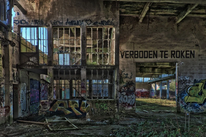 an abandoned building with graffiti all over it, by Andries Both, flickr, postprocessed, gerit dou, ((oversaturated)), factory floor
