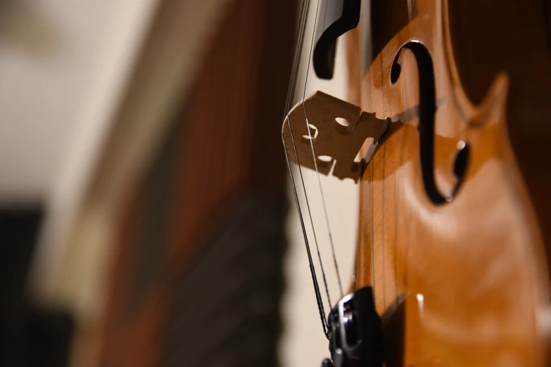 a close up of a clock on a wall, by Tom Carapic, violin, mild depth of field, concert, banner