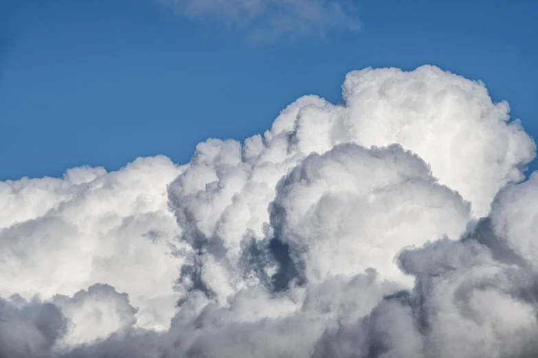 a jetliner flying through a cloud filled sky, a picture, by Hans Schwarz, precisionism, today\'s featured photograph 4k, cumulus, mid closeup, smoke columns