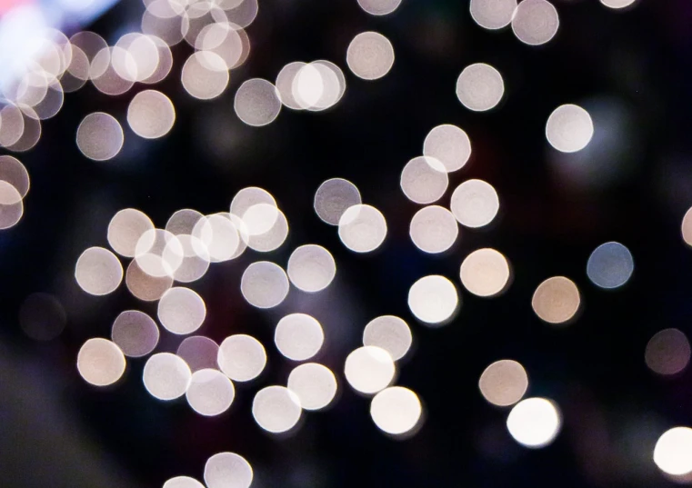 a close up of a cell phone in front of a christmas tree, by Jan Rustem, pexels, pointillism, light circles, dots abstract, white lights, wallpaper - 1 0 2 4