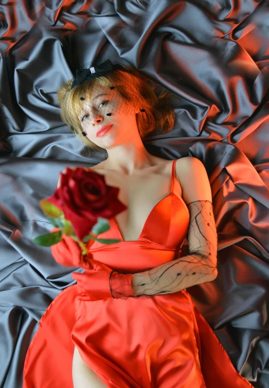 a woman laying on a bed with a rose in her hand, inspired by Taro Yamamoto, romanticism, cosplay photo, coral red, cai xukun, love death and robots