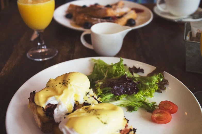 a close up of a plate of food on a table, pexels, renaissance, eggs benedict cumberbatch, a wooden, listing image, drink