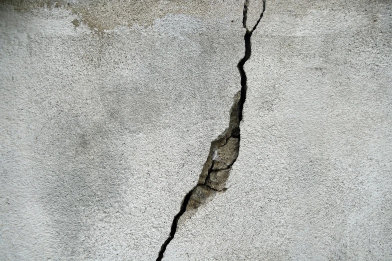 a crack in the side of a concrete wall, shutterstock, concrete art, shanghai, demolition, m, panel