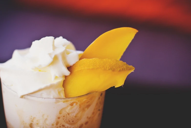a close up of a dessert in a glass, by Max Buri, pexels, mango, whipped cream, shot on kodak vision 200t, slush!!