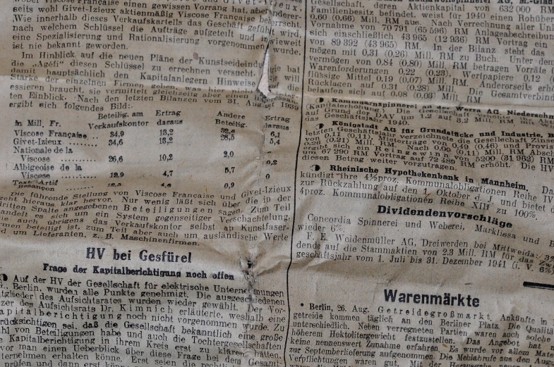 a piece of newspaper sitting on top of a table, by Margaret Leiteritz, reddit, berlin secession, paper texture 1 9 5 6, old signs, high details photo, football
