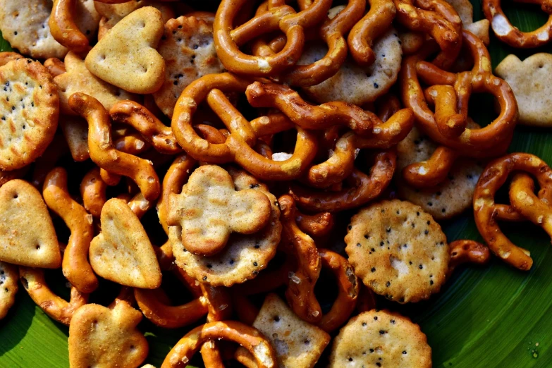 a green plate topped with crackers and pretzels, a portrait, pexels, hurufiyya, sri lanka, gnarly details soft light, square, abundant detail