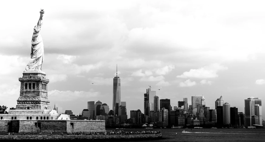 a black and white photo of the statue of liberty, a black and white photo, inspired by Thomas Struth, pexels, minimalism, skyline showing from the windows, captured with sony a3 camera, urban skyline, nypd