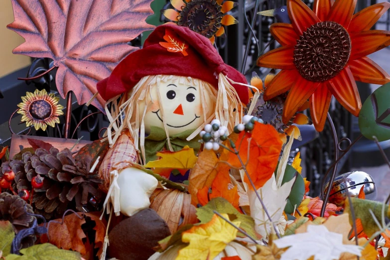 a scarecrow sitting on top of a pile of autumn leaves, trending on pixabay, folk art, decorated with flowers, square, face center close-up, parade floats