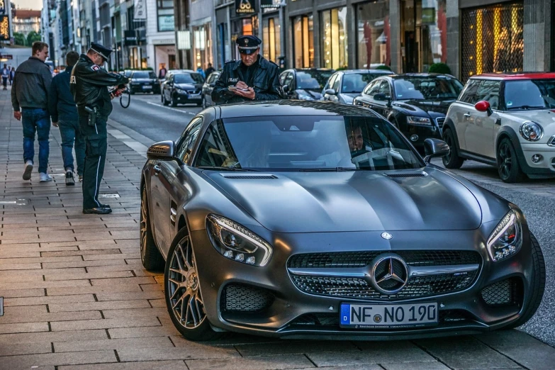 a mercedes sports car parked on the side of the road, by Thomas Häfner, pexels contest winner, happening, city of munich!!!, mean smirk, henrik fisker, bronze!! (eos 5ds r