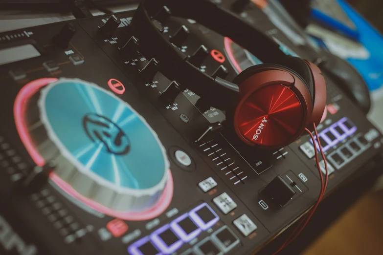 a close up of a dj controller with headphones on, a picture, by Romain brook, pexels, digital art, red and brown color scheme, color ( sony a 7 r iv, red and blue color scheme, silver white red details