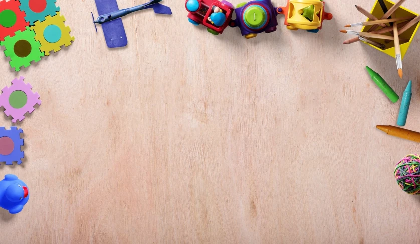 a group of toys sitting on top of a wooden table, a stock photo, trending on pixabay, conceptual art, airplane hanger background, wide overhead shot, istockphoto, on a pale background