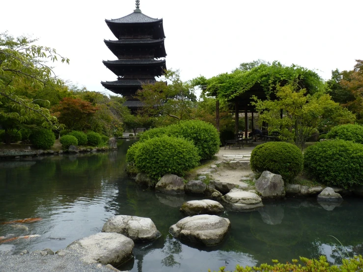 a japanese garden with a pagoda in the background, inspired by Gusukuma Seihō, flickr, shin hanga, zhouzhuang ancient town, flooded ancient tower, big towers, high res