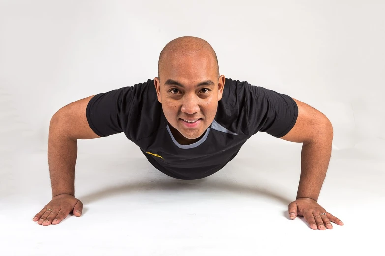 a man doing push ups on a white background, a photo, inspired by Eddie Mendoza, front portrait, 1 / 4 headshot, malaysian, john picacio and brom