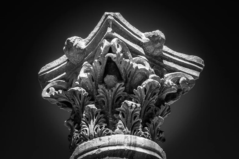 a black and white photo of a column, featured on zbrush central, romanesque, dramatic closeup composition, ornamental halo, vibrant contrast, taken with sony a7r camera