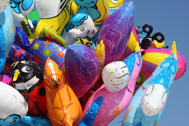 a bunch of balloons that are in the air, a surrealist sculpture, inspired by Jeff Koons, flickr, toyism, lisa frank & sho murase, random detail, having fun in the sun, army of robotic space penguins