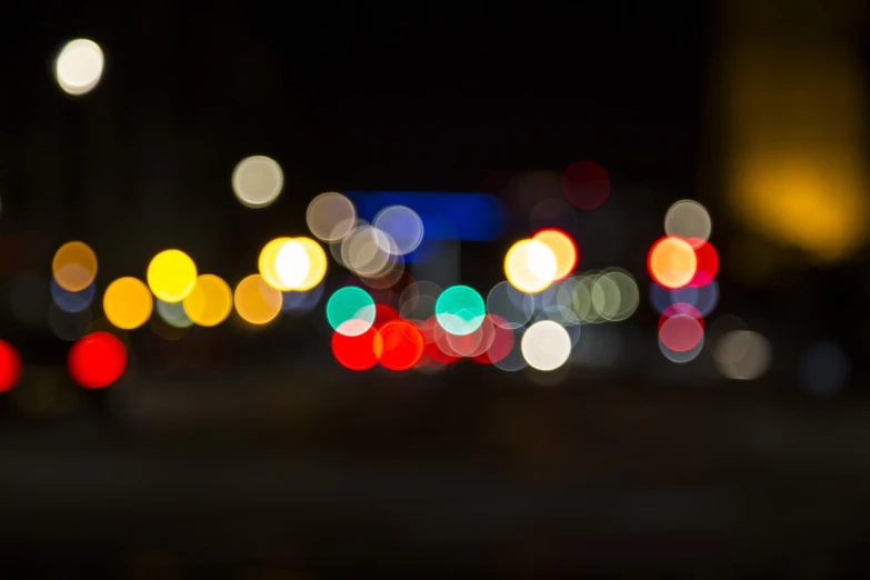 a blurry photo of a city street at night, a picture, shutterstock, bauhaus, macro bokeh ”, multicolored glints, bokeh photo