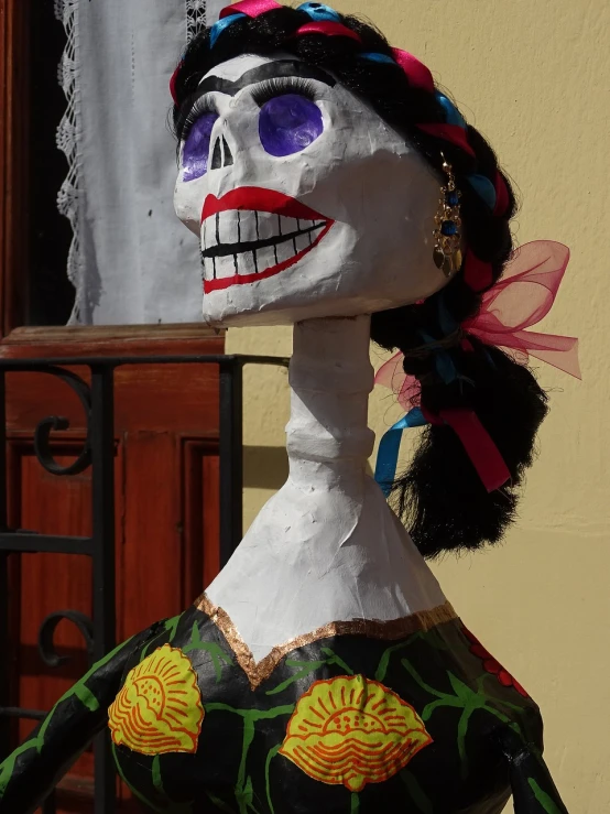 a close up of a statue of a woman, a statue, by Robert Zünd, folk art, la catrina, head and full body view, todo hecho con papel de pinata, long neck