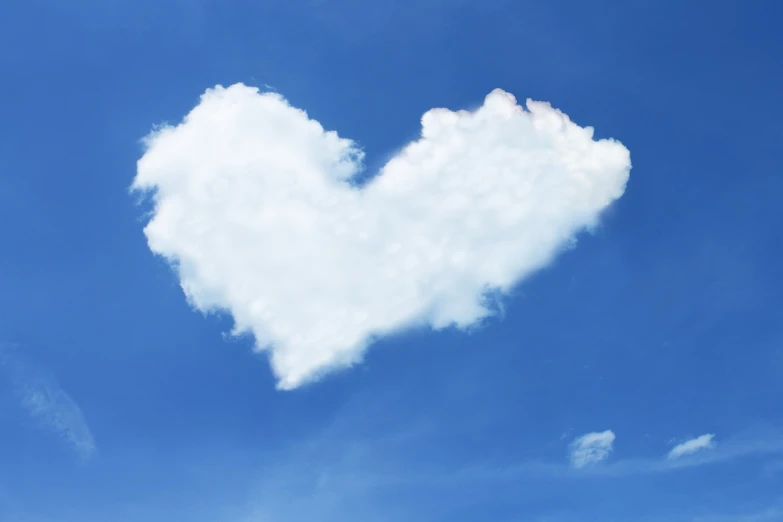 a cloud shaped like a heart in the sky, istockphoto, with a blue background, ceremonial clouds, screen cap