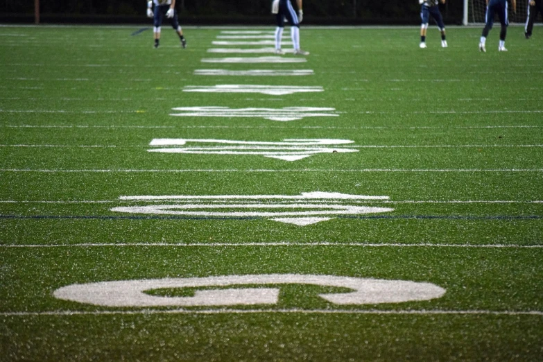 a group of young men playing a game of soccer, by Carey Morris, pixabay, on a football field, glowing ceremonial markings, photograph credit: ap, lined up horizontally