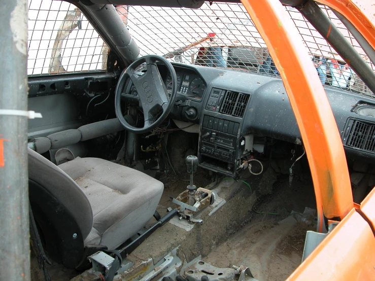 a picture of the inside of a car, by Richard Carline, flickr, auto-destructive art, orange body, toyota cresta, rubble!!, iroc