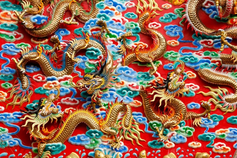 a red table topped with lots of gold dragon figurines, a detailed painting, shutterstock, cloisonnism, dragon! dragon! dragon!, dragon skin background, colourful!! highly detailed, the taoist temples of huangshan