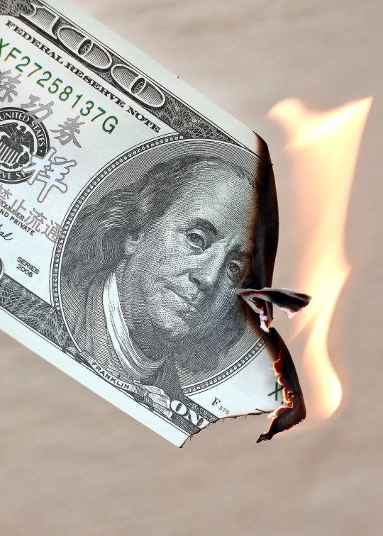 a close up of a burning dollar bill, a photo, by Tom Carapic, fine art, photorealism. trending on flickr, 2 0 1 0 photo, serious business, unbalanced